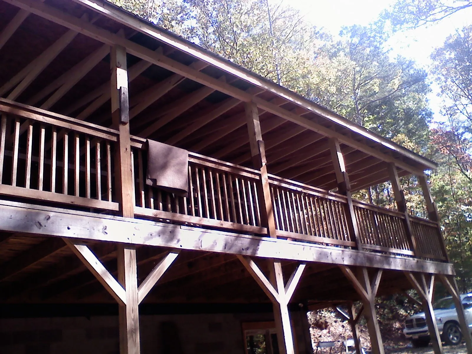 Timber framing under a new elevated porch and deck — Roof Leak Repair in Choctaw by Roofing Brothers